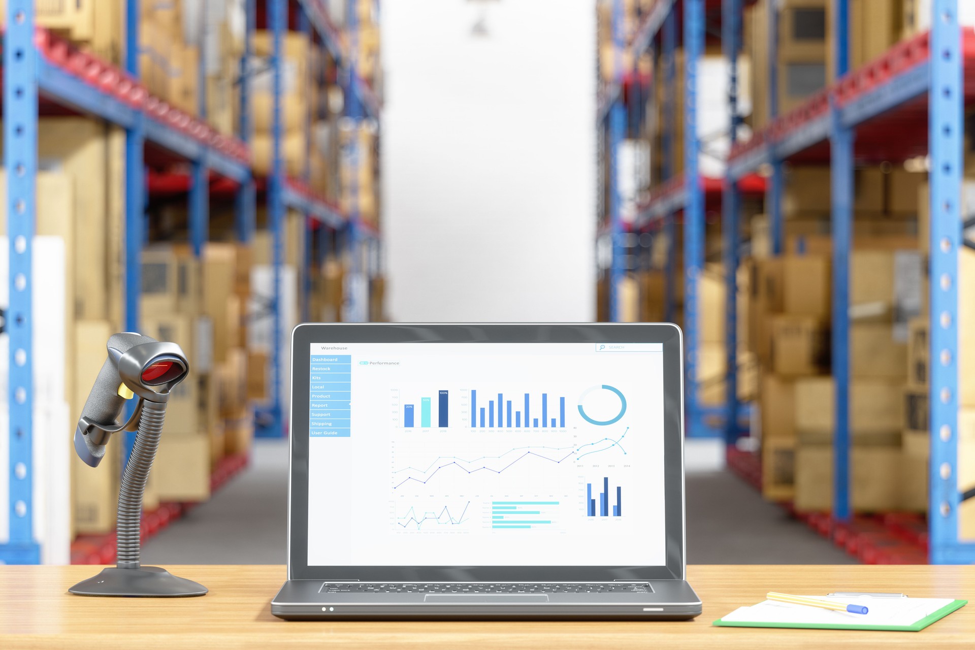 Laptop and barcode scanner on desk in a warehouse